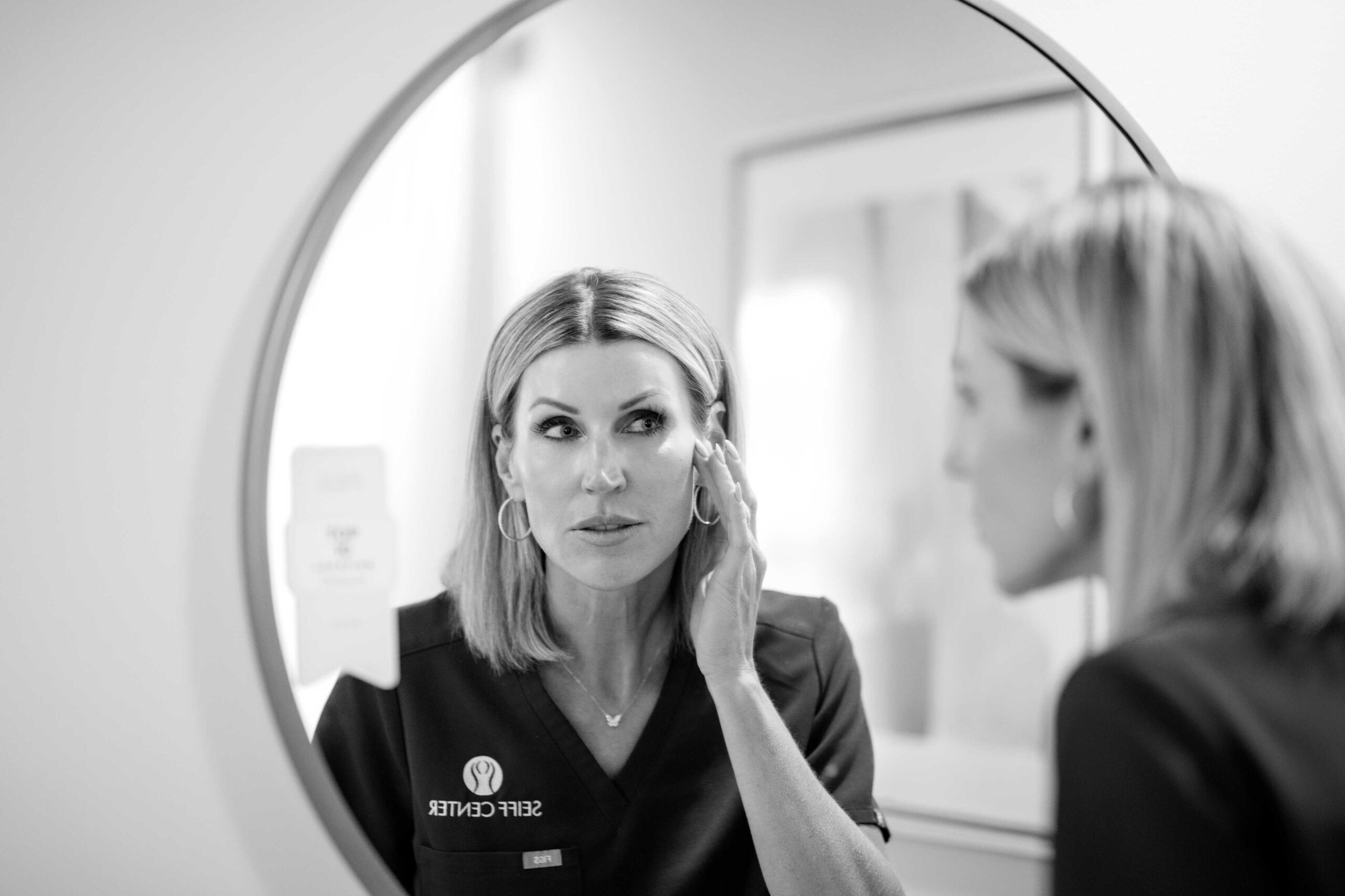 Black and white image of Seiff Center provider preparing treatment materials