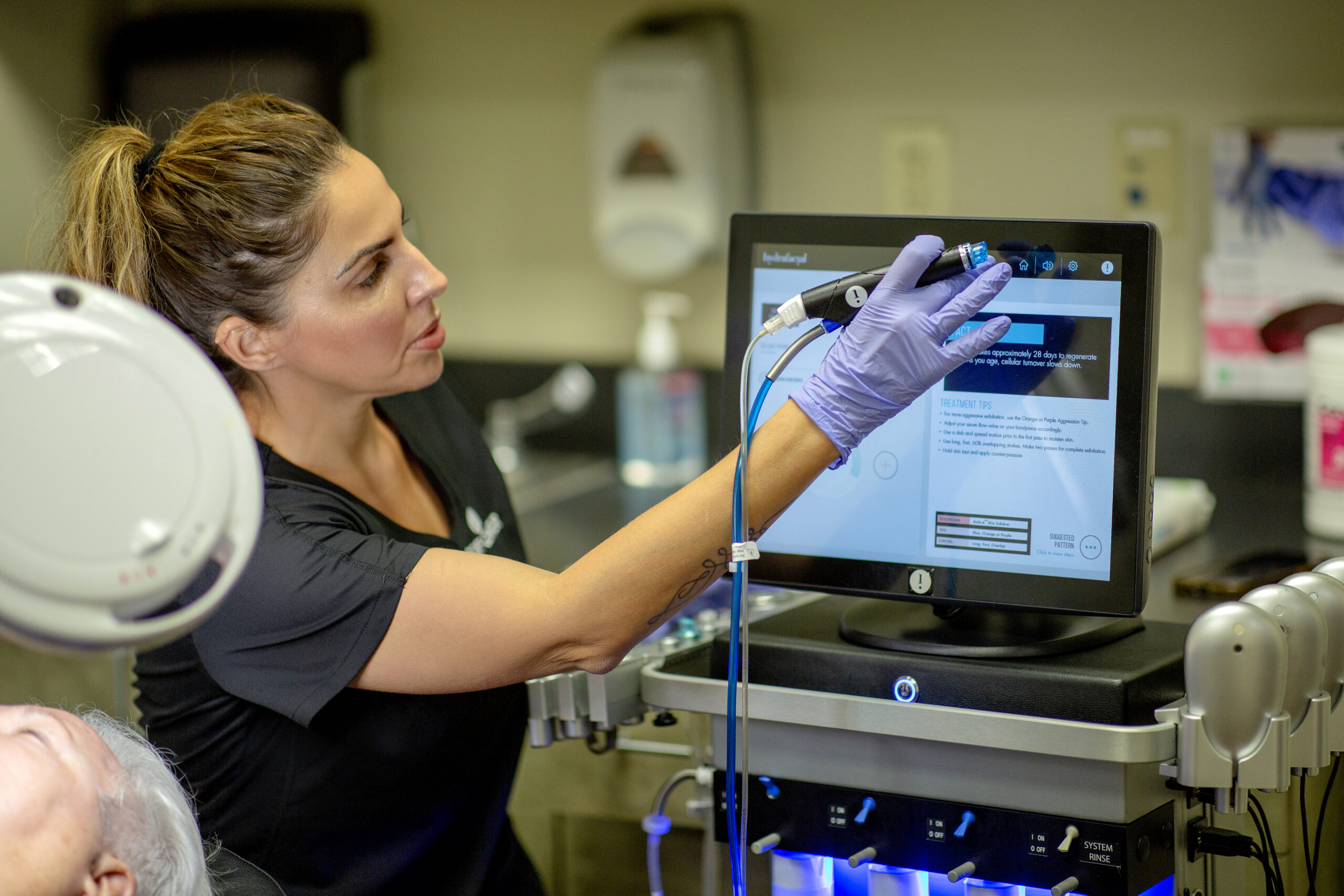Tania Martins reviewing data on the monitor