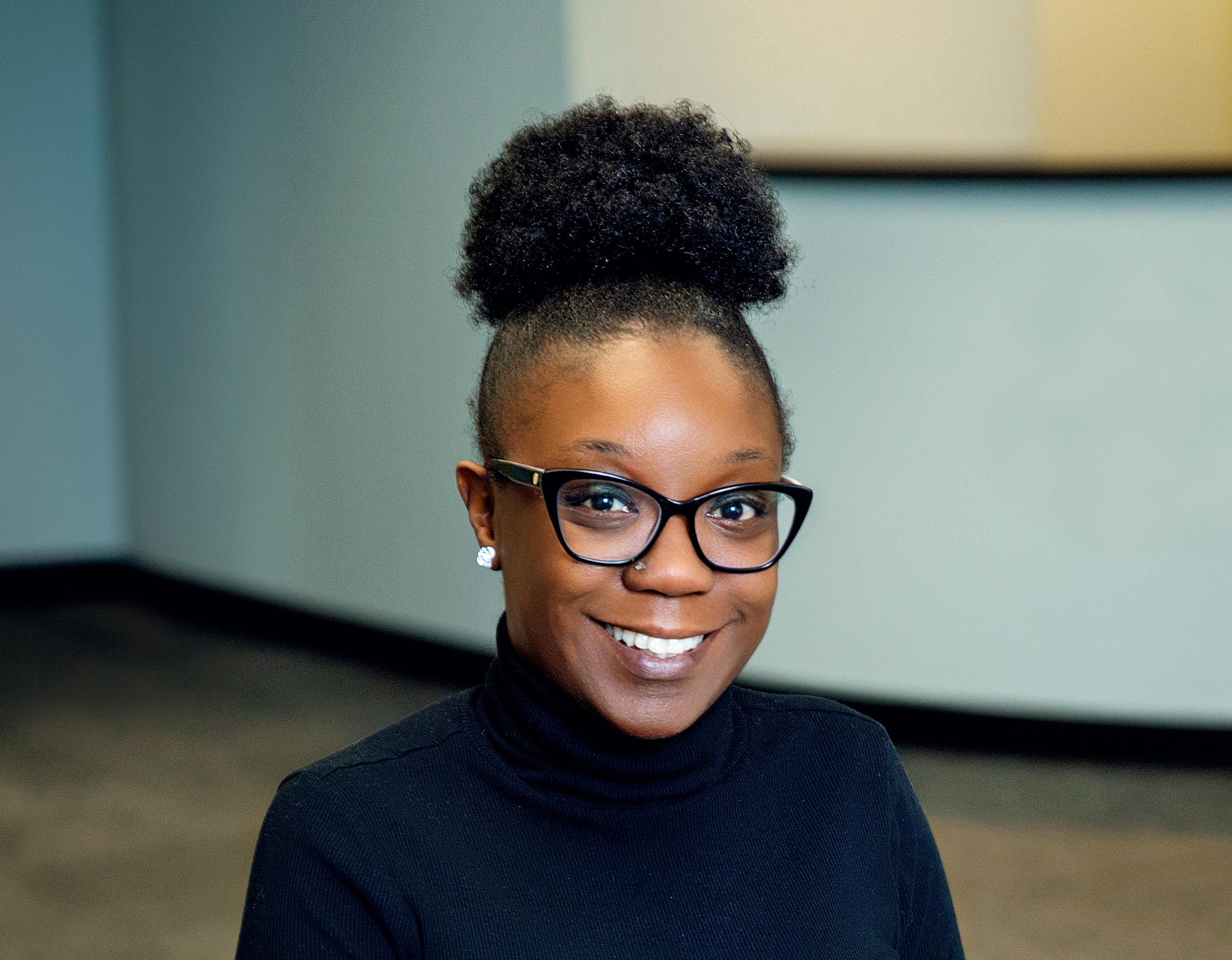 Ashley Evans smiling at the camera at Seiff Center