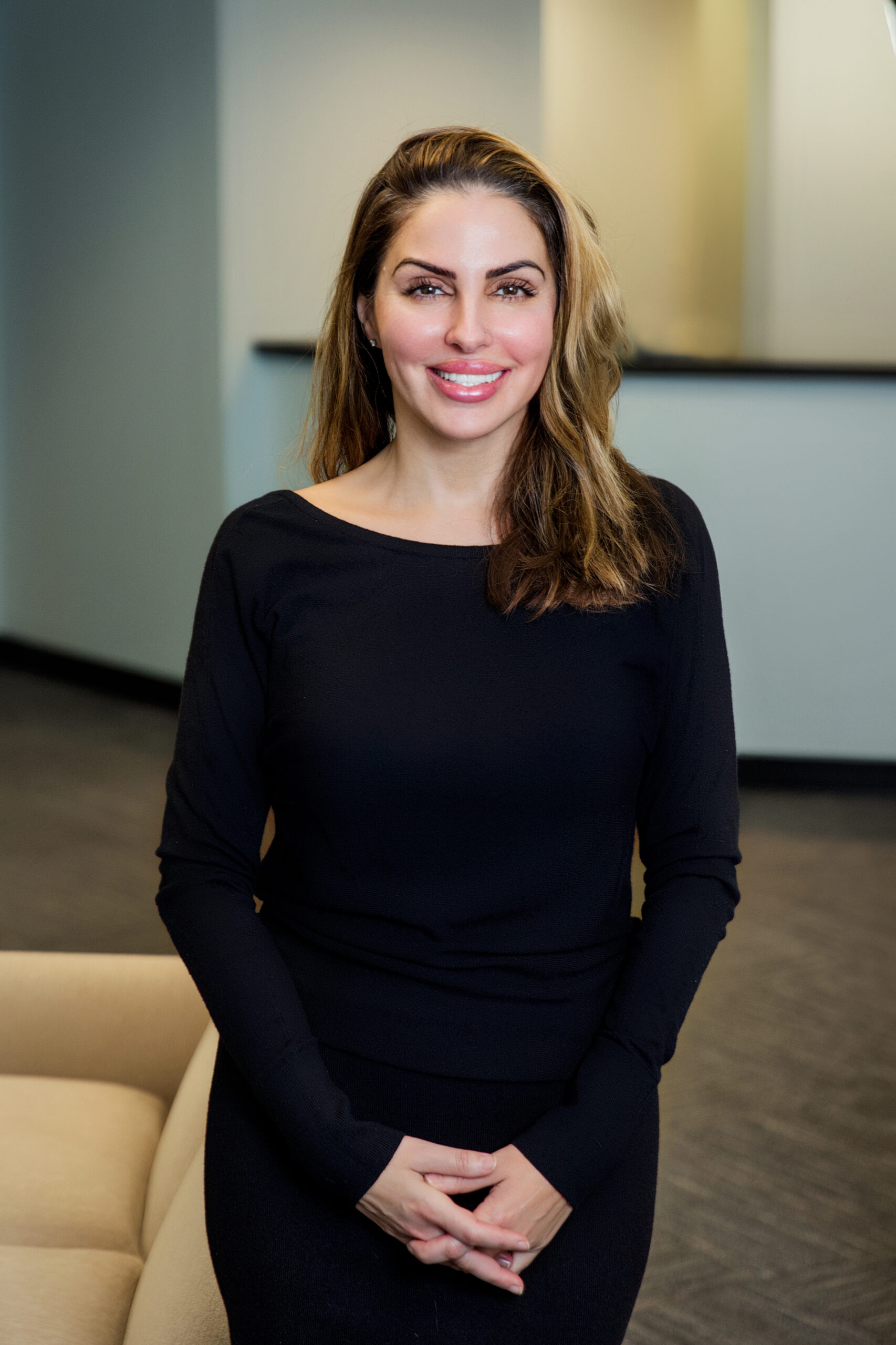 Tania Martins smiling in the lobby