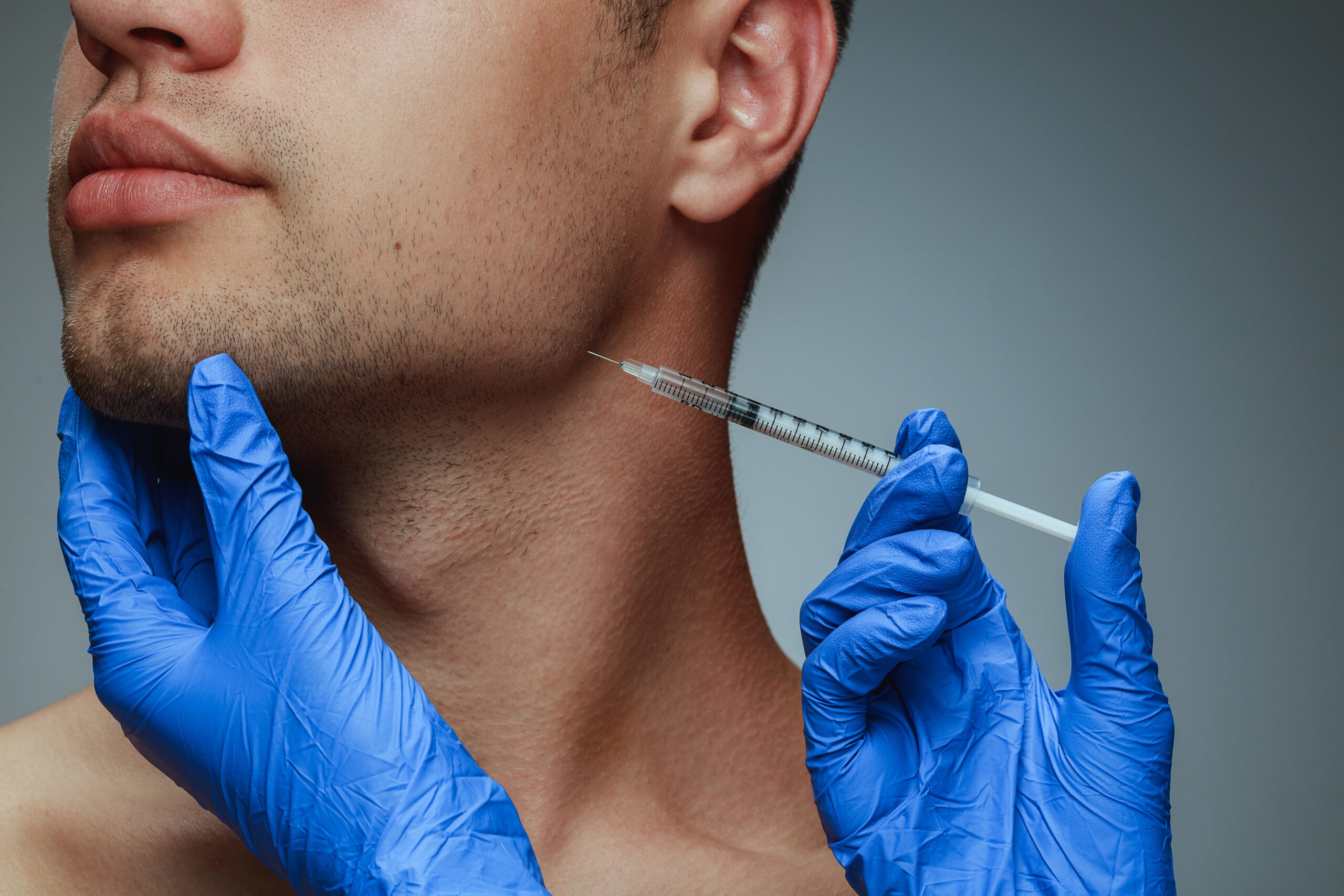 a man injecting a botox